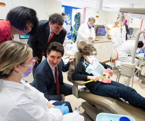 March 31, 2023, Moncton, NB, Canada: Prime Minister Justin Trudeau, centre, Minister Dominic LeBlanc, Intergovernmental Affairs, Infrastructure and Communities and Minister Ginette Petitpas Taylor, Official Languages and Minister responsible for the Atlantic Canada Opportunities Agency, speaks with dental hygienist students and patients at Oulton College in Moncton, N.B., on Friday, March 31, 2023. Moncton Canada  - ZUMAc35_ 20230331_zaf_c35_063 Copyright: xRonxWardx
