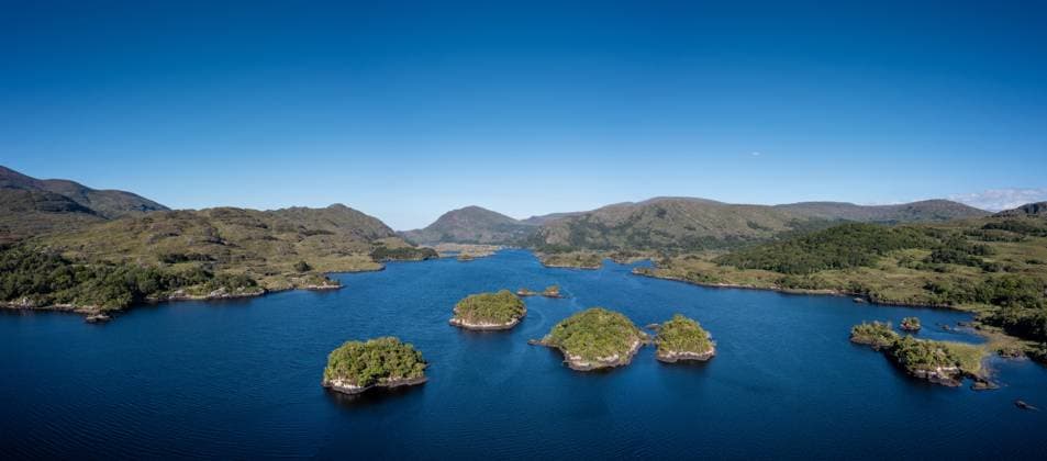 A panorama landscape of the Upper Lake and Purple Mountains in Killarney National Park A panorama landscape of the Upper Lake and Purple Mountains in Killarney National Park Copyright: xZoonar.com NandoxLardix 18970221
