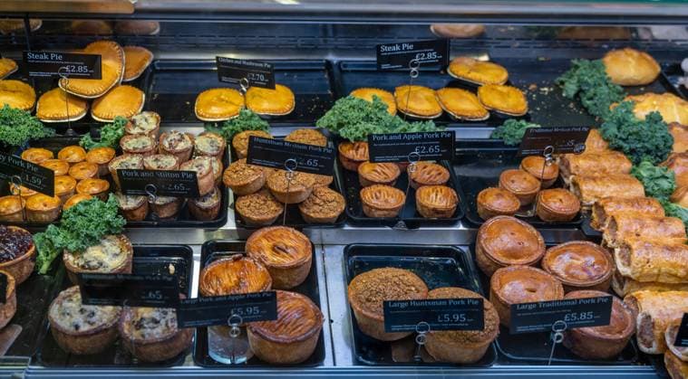Conwy Conwy, United Kingdom - 27 August, 2022: close-up view of a butcher shop showcase with a variety of steak and pork pies Copyright: xZoonar.com NandoxLardix 19242310