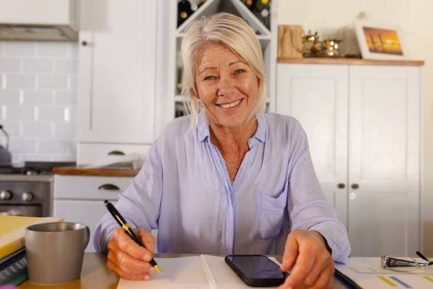 Happy senior caucasian woman sitting at table in kitchen, having video call Happy senior caucasian woman sitting at table in kitchen, having video call. Spending quality time at home alone., model released, , property released, Cape Town, South Africa, 2022-09-08T22:00:00.000Z, 3830267.jpg, people, happy, senior, caucasian woman, sitting, table, kitchen, video call, spending, quality time, home, alone, young, lifestyle, person, indoors, room, house, adult, smile, interior, smiling, cheerful, portrait, food, cooking, cute, fun, wooden, happiness, attractive, caucasian, woman, video, call, quality, time Mature Adult,Woman,Female,White