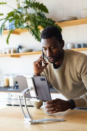 Happy african american man leaning on countertop in kitchen, using tablet and talking on smartphone Happy african american man leaning on countertop in kitchen, using tablet and talking on smartphone. Spending quality time at home alone., model released, , property released, Cape Town, South Africa, 2022-09-14T22:00:00.000Z, 3847014.jpg, people,happy,african american,man,leaning,countertop,kitchen,using tablet,talking,smartphone,spending,quality time,home,alone,phone,young,mobile,lifestyle,cellphone,person,smiling,smile,house,adult,cheerful,indoors,room,portrait,sitting,attractive,fun,happiness,cute,african,american,using,tablet,quality,time Young Adult,Man,Male,Black