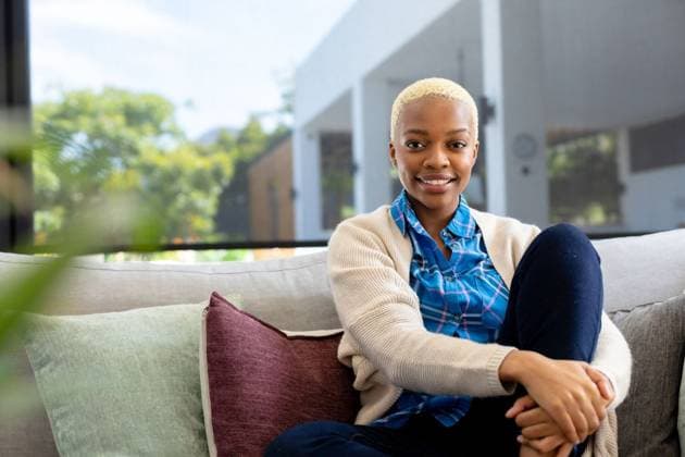 Portrait of happy african american woman sitting on sofa, looking at camera and smiling Portrait of happy african american woman sitting on sofa, looking at camera and smiling. Spending quality time at home alone, domestic life and lifestyle concept., model released, , property released, Cape Town, South Africa, 2022-09-28T22:00:00.000Z, 3935049.jpg, people,portrait,happy,african american,woman,sitting,sofa,smiling,spending,quality time,home,alone,domestic life,concept,young,person,adult,lifestyle,cheerful,attractive,smile,cute,happiness,indoors,pretty,face,casual,fun,room,looking,beautiful,couch,house,african,american,camera,quality,time,domestic,life Young Adult,Woman,Female,Black