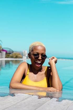 Portrait of happy african american woman wearing sunglasses in swimming pool Portrait of happy african american woman wearing sunglasses in swimming pool. Spending quality time at home alone, domestic life and lifestyle concept., model released, , property released, Cape Town, South Africa, 2022-09-28T22:00:00.000Z, 3935082.jpg, people,portrait,happy,african american,woman,wearing,sunglass,swimming pool,spending,quality time,home,alone,domestic life,concept,young,person,lifestyle,adult,smile,attractive,cute,face,cheerful,pretty,happiness,beautiful,fun,smiling,house,white,background,business,looking,african,american,swimming,pool,quality,time,domestic,life Young Adult,Woman,Female,Black