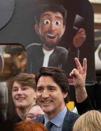 April 3, 2023, Val d Or, PQ, Canada: An employee gives Prime Minister Justin Trudeau öÄÃ²bunny earsöÄÃ as they pose for a group photo following a news conference in a grocery store in Val d Or, Que., Monday, April 3, 2023. Val d Or Canada  - ZUMAc35_ 20230403_zaf_c35_046 Copyright: xAdrianxWyldx