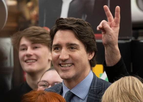 April 3, 2023, Val d Or, PQ, Canada: An employee gives Prime Minister Justin Trudeau öÄÃ²bunny earsöÄÃ as they pose for a group photo following a news conference in a grocery store in Val d Or, Que., Monday, April 3, 2023. Val d Or Canada  - ZUMAc35_ 20230403_zaf_c35_047 Copyright: xAdrianxWyldx