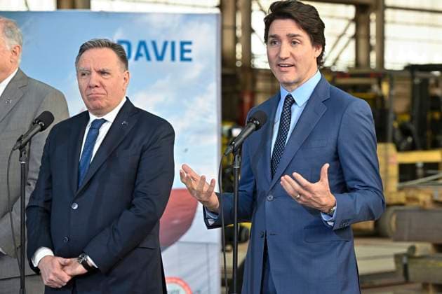 April 4, 2023, LEVIS, PQ, Canada: Prime Minister Justin Trudeau, right, responds to reporters questions at a news conference after announcing major investments in shipbuilding, Tuesday, April 4, 2023 at the Davie shipyard in Levis, Que. Quebec Premier Francois Legault, left, looks on. LEVIS Canada - ZUMAc35_ 20230404_zaf_c35_054 Copyright: xJacquesxBoissinotx