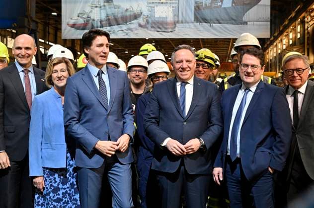 April 4, 2023, LEVIS, PQ, Canada: Prime Minister Justin Trudeau, centre left, and Quebec Premier Francois Legault, centre right, pose with Davie shipyard workers after announcing major investments in shipbuilding, Tuesday, April 4, 2023 at the Davie shipyard in Levis ,Que. They are flanked by Minister of Health, Jean-Yves Duclos, from the left, Minister of Public Services and Procurement, Helena Jaczek, Quebec Education Minister Bernard Drainville and Levis Mayor Gilles Lehouillier. LEVIS Canada - ZUMAc35_ 20230404_zaf_c35_056 Copyright: xJacquesxBoissinotx