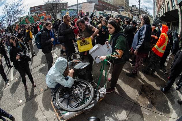 April 5, 2023, Vancouver, British Columbia, Canada: A woman is helped removing some personal belongings Hastings Street in Vancouver, Canada, as police and city crews remove a homeless encampment April 5. The City of Vancouver requested a heavy police presence for the safety of crews clearing the tents, temporary structures and personal effects of homeless residents who have camped on the sidewalk for about eight months, sometimes blocking the entrances of businesses and residencies. The move follows the closure of encampments in public parks two years ago at the onset of whatâ€⠢s now Canadaâ€⠢s worst affordable housing crisis. Motivating the latest sweep, officials cited a spike in fires, assaults, robberies and other public saf - ZUMAb217 20230405_zip_b217_005 Copyright: xQuinnxBenderx
