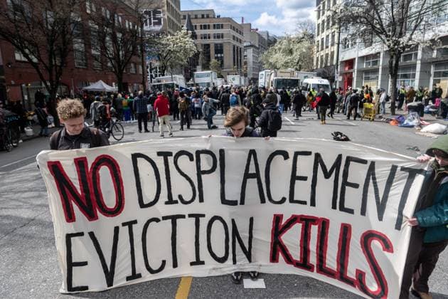 April 5, 2023, Vancouver, British Columbia, Canada: Demonstrators take to East Hastings Street in Vancouver, Canada, as police and city crews remove a homeless encampment. The City of Vancouver requested a heavy police presence for the safety of crews clearing the tents, temporary structures and personal effects of homeless residents who have camped on the sidewalk for about eight months, sometimes blocking the entrances of businesses and residencies. The move follows the closure of encampments in public parks two years ago at the onset of whatâ€⠢s now Canadaâ€⠢s worst affordable housing crisis. Motivating the latest sweep, officials cited a spike in fires, assaults, robberies and other public safety concerns in a neighbourhood wi - ZUMAb217 20230405_zip_b217_008 Copyright: xQuinnxBenderx