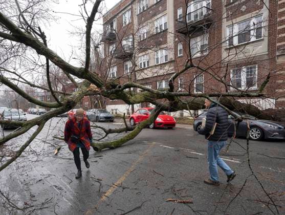 April 6, 2023, Montreal, PQ, Canada: Pedestrians make their way around debris in Montreal, Thursday, April 6, 2023 after an ice storm which left more than a million customers without power in Quebec. Montreal Canada  - ZUMAc35_ 20230406_zaf_c35_013 Copyright: xRyanxRemiorzx