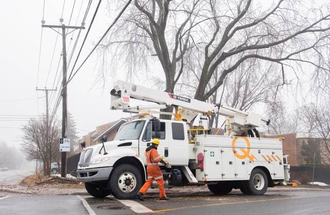 April 6, 2023, Montreal, PQ, Canada: A Hydro Quebec truck is shown on a street following an ice storm in Montreal, Thursday, April 6, 2023. More than one million customers in Quebec and Ontario were without power Wednesday after a messy mix of freezing rain and thunderstorms pummeled parts of both provinces. Montreal Canada  - ZUMAc35_ 20230406_zaf_c35_030 Copyright: xGrahamxHughesx