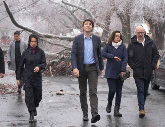 April 6, 2023, Montreal, PQ, Canada: Prime Minister Justin Trudeau watches for falling ice as he surveys the damage with Mayor Valerie Plante after yesterdayöÄÃ s ice storm, which left over a million customers without power, in Montreal, Thursday, April 6, 2023. Montreal Canada  - ZUMAc35_ 20230406_zaf_c35_077 Copyright: xRyanxRemiorzx