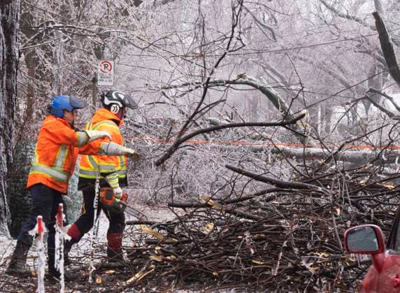 April 6, 2023, Montreal, PQ, Canada: City workers clears fallen branches after yesterdayöÄÃ s ice storm, which left over a million customers without power, in Montreal, Thursday, April 6, 2023. Montreal Canada  - ZUMAc35_ 20230406_zaf_c35_086 Copyright: xRyanxRemiorzx
