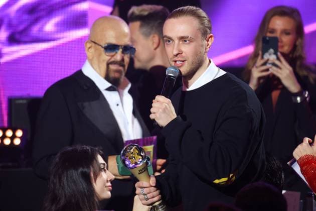 RUSSIA, KRASNOGORSK - APRIL 6, 2023: Singers Mikhail Shufutinsky (L) and Egor Krid (Yegor Bulatkin) accept an award at a ceremony to present the 2023 Zhara Music Awards at the Crocus City Hall. Vyacheslav Prokofyev TASS  58269014