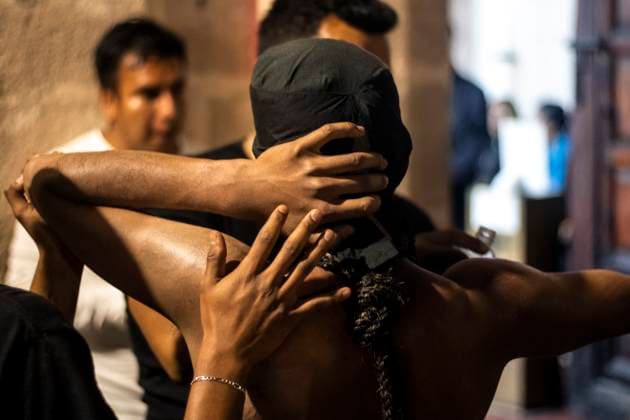 México: Good Friday in Taxco Guerrero penitent at the end of the tour Penitents of Taxco carried out their traditional procession of the Three Fallen among cobblestone streets accompanied by sounds and prayers. During the procession you can see how the penitents flagellate themselves or carry sticks of thorns to demonstrate their faith towards God. Tourists and pilgrims arrived in the city to witness this traditional ritual. Taxco Guerrero Mexico Taxco Guerrero Copyright: LuisxSalgado