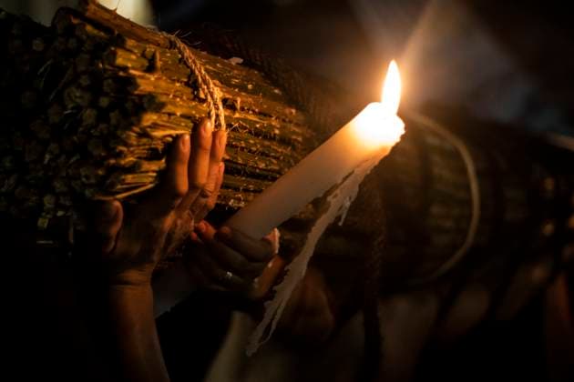 México: Good Friday in Taxco Guerrero Penitent citizen holds candle and at the same time carries the thorn sticks. Penitents of Taxco carried out their traditional procession of the Three Fallen among cobblestone streets accompanied by sounds and prayers. During the procession you can see how the penitents flagellate themselves or carry sticks of thorns to demonstrate their faith towards God. Tourists and pilgrims arrived in the city to witness this traditional ritual. Taxco Guerrero Mexico Taxco Guerrero Copyright: LuisxSalgado