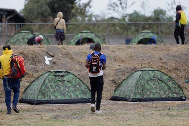 Haitian Migrants Relocated To Shelter In Mexico City Haitian migrants in front of tents at the Bosque de Tlahuac facilities in Mexico City, who were supported by the National Institute of Migration and the Secretariat for Inclusion and Social Welfare, which offered food, lodging, and migratory guidance while they are at home. waiting for a permit or Visitor s Card for Humanitarian Reasons that allows them to transit through national territory between 45 and 90 days to continue their journey to the border. Mexico City Mexico City Mexico  Copyright: xGerardoxVieyrax originalFilename: vieyra-notitle230410_npj5D.jpg