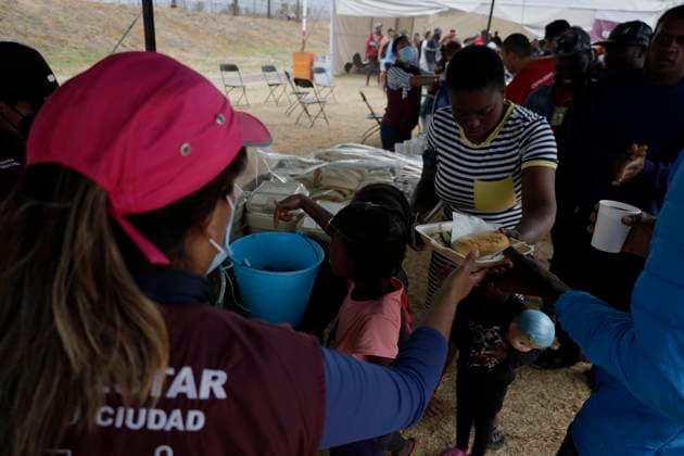 Haitian Migrants Relocated To Shelter In Mexico City Haitian migrants during their lunch hour at the Bosque de Tlahuac facilities in Mexico City, where several people were supported by the National Institute of Migration and the Secretariat for Inclusion and Social Welfare who offered food, lodging, and migration guidance while they are waiting for a permit or Visitor s Card for Humanitarian Reasons that allows them to transit through national territory between 45 and 90 days to continue their journey to the border. Mexico City Mexico City Mexico  Copyright: xGerardoxVieyrax originalFilename: vieyra-notitle230410_npfFo.jpg