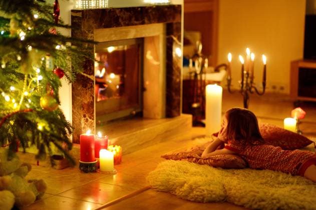 RECORD DATE NOT STATED Happy little girl sitting by a fireplace in a cozy dark living room on Christmas eve, model released, , 32051310.jpg, christmas, gift, scene, tree, home, room, decorations, interior, child, fire, indoor, love, warmth, living room, warm, toddler, decorated, sitting, seasonal, bright, thoughtful, festive, luxury, celebration, open, luxurious, living, traditional, cozy, family, christmas tree, place, decorative, girl, design, fireside, december, together, inside, classic, house, kid, romantic, lounge, siblings, candles, fireplace, alone