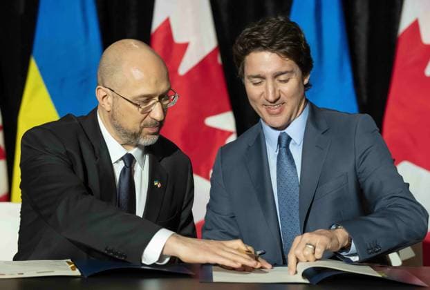 April 11, 2023, TORONTO, ON, CANADA: Ukrainian Prime Minister Denys Shmyhal and Prime Minister Justin Trudeau sign an agreement in Toronto, Tuesday, April 11, 2023. TORONTO CANADA  - ZUMAc35_ 20230411_zaf_c35_033 Copyright: xFrankxGunnx