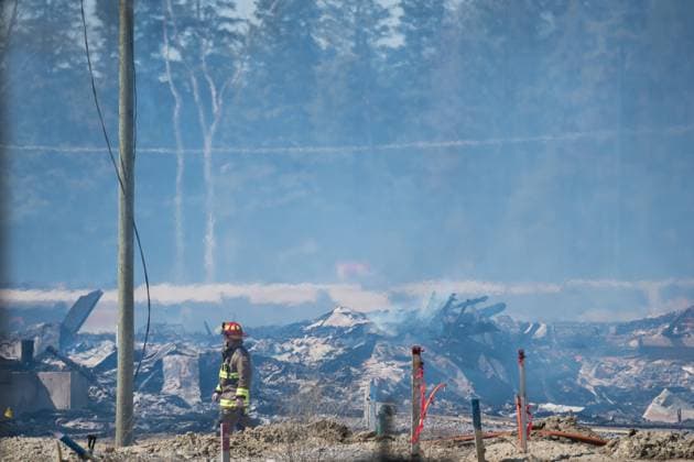 April 12, 2023, Vaughan, ONT, CANADA: A Firefighter walks through the damage as they continue to battle a large fire in a new housing development area near Pine Heights and Teston Road, in Vaughan, Ont., Wednesday, April 12, 2023. Vaughan CANADA  - ZUMAc35_ 20230412_zaf_c35_039 Copyright: xTijanaxMartinx