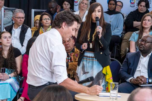 April 13, 2023, Regina, SK, Canada: Federation of Sovereign Indigenous Nations Third Vice Chief Aly Bear asks a question to Prime Minister Justin Trudeau at a town hall at the First Nations University of Canada in Regina, Thursday, April 13, 2023. Regina Canada  - ZUMAc35_ 20230413_zaf_c35_159 Copyright: xLiamxRichardsx