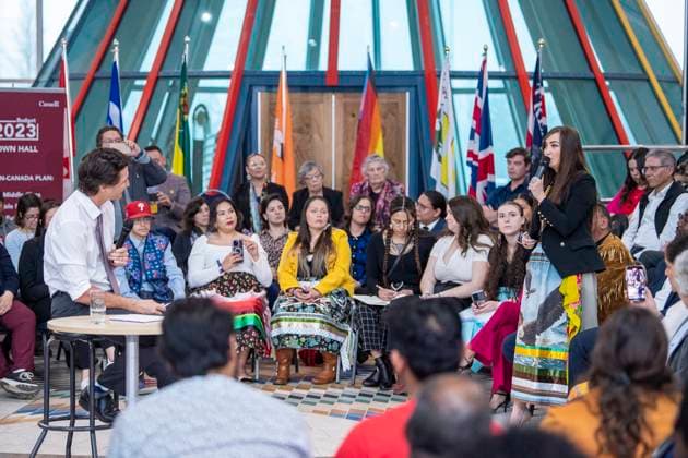 April 13, 2023, Regina, SK, Canada: Federation of Sovereign Indigenous Nations Third Vice Chief Aly Bear asks a question to Prime Minister Justin Trudeau at a town hall at the First Nations University of Canada in Regina, Thursday, April 13, 2023. Regina Canada  - ZUMAc35_ 20230413_zaf_c35_182 Copyright: xLiamxRichardsx