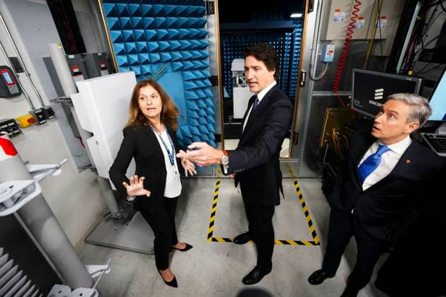 April 17, 2023, Ottawa, ON, CAN: Prime Minister Justin Trudeau and Minister of Innovation, Science and Industry Francois-Philippe Champagne, right, are given a tour of a lab at Ericsson prior to holding an announcement and press conference in Ottawa on Monday, April 17, 2023. Ottawa CAN  - ZUMAc35_ 20230417_zaf_c35_013 Copyright: xSeanxKilpatrickx