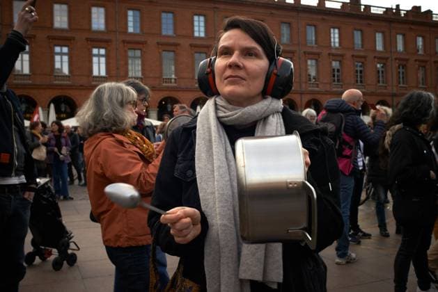 Pot Concert During Macron s Speech On Tvs And Radios A few thousands people gathered in front of the Capitole in Toulouse for a pot concert at the same French President Macron spoke on TVs and radios. They are angered by the decision to validate the pension bill by the consitutional council and its promulgation by Macron soon after. The pension bill will delay retirement by two years to 64 and was pushed through parliament by the government without a vote.Polls show 64% french people say they want the stirkes to intensify and that 93% of workers oppose the pension reform. The retirement age would be raised to 64 years (for 43 years of continued work) and the pensions will be lower specially for women, short careers and low wages people. T  Copyright: xAlainxPittonx originalFilename: pitton-notitle230417_np4lw.jpg