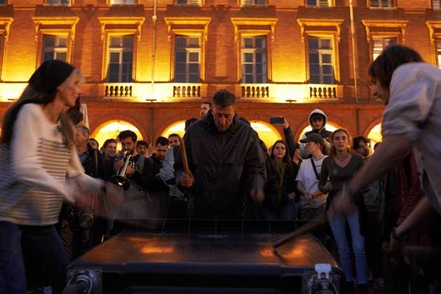 Pot Concert During Macron s Speech On Tvs And Radios A few thousands people gathered in front of the Capitole in Toulouse for a pot concert at the same French President Macron spoke on TVs and radios. They are angered by the decision to validate the pension bill by the consitutional council and its promulgation by Macron soon after. The pension bill will delay retirement by two years to 64 and was pushed through parliament by the government without a vote.Polls show 64% french people say they want the stirkes to intensify and that 93% of workers oppose the pension reform. The retirement age would be raised to 64 years (for 43 years of continued work) and the pensions will be lower specially for women, short careers and low wages people. T  Copyright: xAlainxPittonx originalFilename: pitton-notitle230417_npBcB.jpg