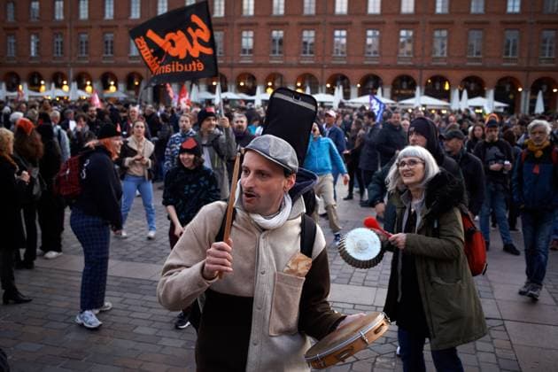 Pot Concert During Macron s Speech On Tvs And Radios A few thousands people gathered in front of the Capitole in Toulouse for a pot concert at the same French President Macron spoke on TVs and radios. They are angered by the decision to validate the pension bill by the consitutional council and its promulgation by Macron soon after. The pension bill will delay retirement by two years to 64 and was pushed through parliament by the government without a vote.Polls show 64% french people say they want the stirkes to intensify and that 93% of workers oppose the pension reform. The retirement age would be raised to 64 years (for 43 years of continued work) and the pensions will be lower specially for women, short careers and low wages people. T  Copyright: xAlainxPittonx originalFilename: pitton-notitle230417_npjnL.jpg