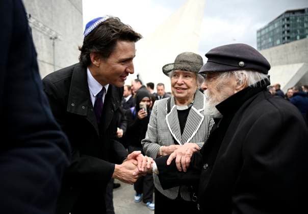 April 18, 2023, Ottawa, ON, CAN: Prime Minister Justin Trudeau speaks with Holocaust survivor Cantor Kraus after a ceremony marking Yom HaShoah, Holocaust Memorial Day, at the National Holocaust Monument in Ottawa, on Tuesday, April 18, 2023. Ottawa CAN  - ZUMAc35_ 20230418_zaf_c35_023 Copyright: xJustinxTangx