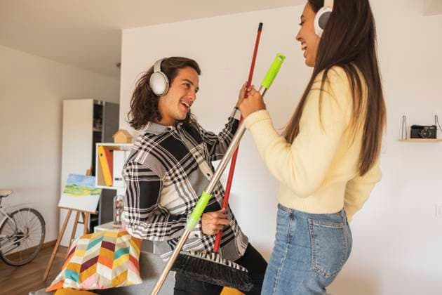 Happy couple with mop having fun at home model released, Symbolfoto property released, JCCMF10206