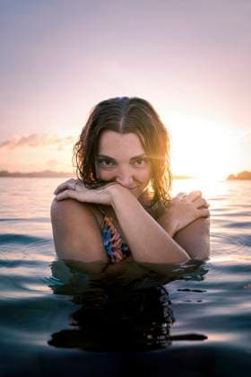 Young woman enjoying in sea on sunset model released, Symbolfoto property released, PNAF05183
