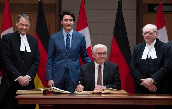 April 24, 2023, Ottawa, ON, Canada: Speaker of the House of Commons Anthony Rota (left) Prime Minister Justin Trudeau and Speaker of the Senate George Furey look on as German President Frank-Walter Steinmeier signs the guest books for the Senate and the House of Commons during a welcome ceremony on Parliament Hill, Monday, April 24, 2023 in Ottawa. Ottawa Canada  - ZUMAc35_ 20230424_zaf_c35_019 Copyright: xAdrianxWyldx