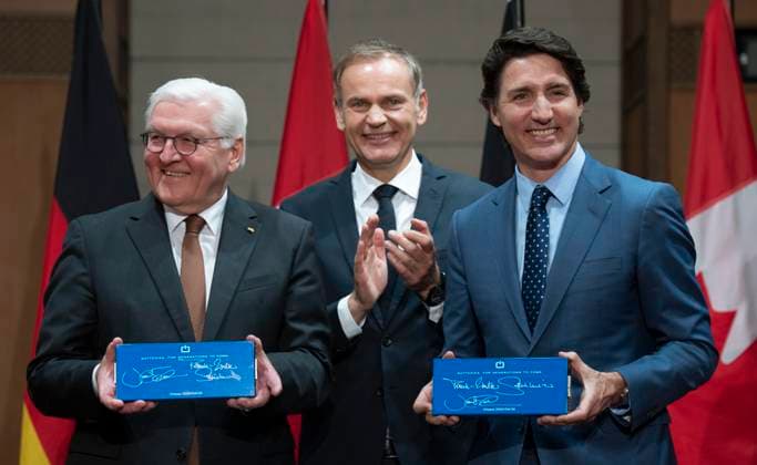 April 24, 2023, Ottawa, ON, Canada: CEO of Volkswagen Group Oliver Blume looks on asPrime Minister Justin Trudeau and German President Frank-Walter Steinmeier share a laugh as they hold up EV battery cells they signed during an event on Parliament Hill, Monday, April 24, 2023 in Ottawa. Ottawa Canada  - ZUMAc35_ 20230424_zaf_c35_022 Copyright: xAdrianxWyldx