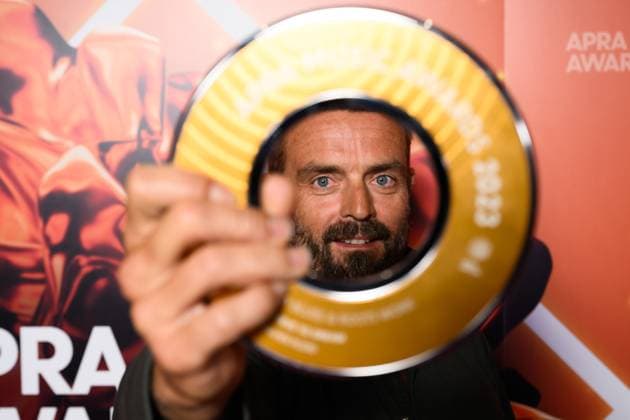 2023 APRA MUSIC AWARDS, Xavier Rudd holds his APRA Award for Most Performed Blues and Roots Work at the 2023 APRA Music Awards at the International Convention Centre, in Sydney, Thursday, April 27, 2023. ( NO ARCHIVING, EDITORIAL USE ONLY, NO USE IN BOOKS WITHOUT CONSENT SYDNEY NSW AUSTRALIA  Copyright: xJAMESxGOURLEYx 20230427001791483931