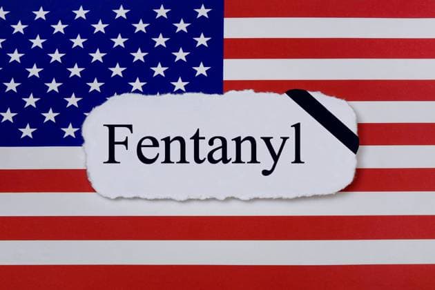 USA flag and fentanyl USA flag and fentanyl, 29 04 2023, Borkwalde, Brandenburg, On a USA flag is the writing Fentanyl