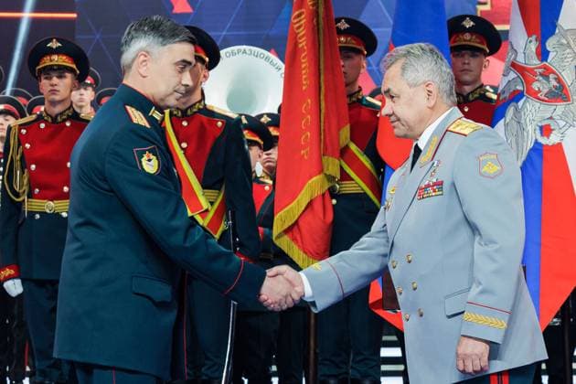 RUSSIA, MOSCOW - APRIL 29, 2023: CSKA head Artyom Gromov (L) and Russia s Defence Minister Sergei Shoigu shake hands at a concert marking the centenary of the CSKA sports club at the Central Academic Theatre of the Russian Army. Vadim Savitsky Russian Defence Ministry Press Office TASS  58742835