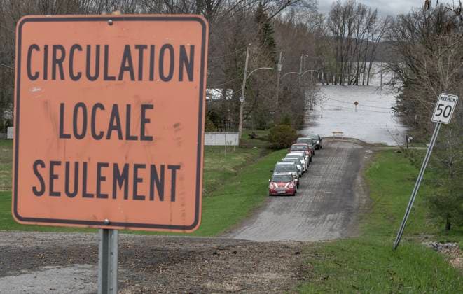 April 30, 2023, Rigaud, PQ, CANADA: Cars are parked on dry roads from homes that are threatened by high water levels along the Ottawa river in the town of Rigaud, Que., just west of the island of Montreal, Sunday, April 30, 2023. The area is on high alert with a total of 30 to 50 millimeter s of rain expected from Sunday evening into Monday. Rigaud CANADA  - ZUMAc35_ 20230430_zaf_c35_024 Copyright: xPeterxMccabex
