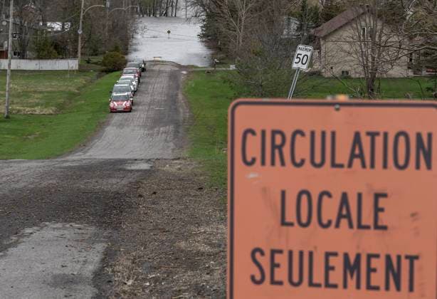 April 30, 2023, Rigaud, PQ, CANADA: Cars are parked on dry roads from homes that are threatened by high water levels along the Ottawa river in the town of Rigaud, Que., just west of the island of Montreal, Sunday, April 30, 2023. The area is on high alert with a total of 30 to 50 millimeter s of rain expected from Sunday evening into Monday. Rigaud CANADA  - ZUMAc35_ 20230430_zaf_c35_025 Copyright: xPeterxMccabex
