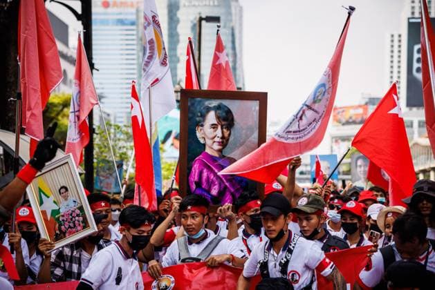 May 1, 2023, Bangkok, Thailand: People hold up a portrait of Aung San Suu Kyi along with flags and clothes with the National Unity Government of Myanmar (NUG) star during a Labor Day march organized by migrant workers from Myanmar in Bangkok, Thailand, Monday, May 01, 2023. Bangkok Thailand - ZUMAm249 20230501_zip_m249_001 Copyright: xAndrexMalerbax