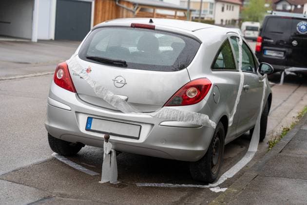 Stettenhofen, Bavaria, Germany - 1 May 2023: to the free night on 1 May toilet paper was distributed on the streets in the village and on vehicles such as cars, or wrapped. Symbol image 1 May prank *** zur Freinacht auf den 1 Mai wurde Toilettenpapier auf den Straßen im Dorf und auf Fahrzeugen wie Autos verteilt, bzw eingewickelt. Symbolbild 1 Mai Streich