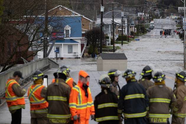 May 1, 2023, BAIE SAINT-PAUL, PQ, CANADA: Firemen line up by the Bas-du-Nord river as the bridge is closed because of flooded roads, Monday, May 1, 2023 in Baie Saint-Paul, Quebec. In Baie-St-Paul, Que., around 90 kilometres northeast of the provincial capital, the mayor declared a state of emergency due to heavy rains that washed away roads and isolated homes. BAIE SAINT-PAUL CANADA - ZUMAc35_ 20230501_zaf_c35_087 Copyright: xJacquesxBoissinotx