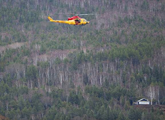 May 1, 2023, BAIE SAINT-PAUL, PQ, CANADA: A search and rescue helicopter patrols the flooded area, looking for two missing people on Monday, May 1, 2023 in Baie-Saint-Paul, Quebec. Provincial police searched on Monday for two people swept away by the current on the flooded Rivio¨re du Gouffre, in Quebec s Charlevoix region, where up to 60 millimetres of rain fell within a 24-hour period. BAIE SAINT-PAUL CANADA - ZUMAc35_ 20230501_zaf_c35_094 Copyright: xJacquesxBoissinotx
