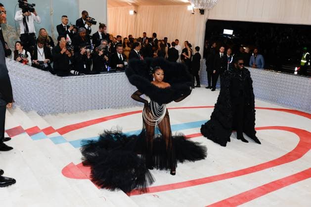 Yung Miami (L) and Sean Diddy Combs arrive on the red carpet for The Met Gala at The Metropolitan Museum of Art celebrating the opening of Karl Lagerfeld: A Line of Beauty in New York City on Monday, May 1, 2023.  NYP20230501296 JOHNxANGELILLO