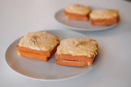 RECORD DATE NOT STATED A vertical closeup shot of classic French specialty, croque-monsieur with grilled cheese *** einer hoch closeupe erschossen des klassisch französisch specialty, croque monsieur mit gegrillt Käse 3519457