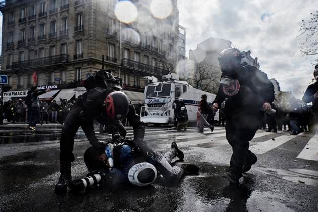 A journalist lying on the ground, during May Day march in Paris.  AntoninxBuratx xLexPictorium LePictorium_0280179