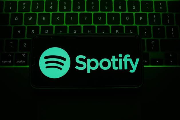 Popular Apps Photo Illustrations A laptop keyboard and Spotify logo displayed on a phone screen are seen in this illustration photo taken in Krakow, Poland on May 7, 2023. Krakow Poland  Copyright: xJakubxPorzyckix originalFilename: porzycki-populara230507_npLEI.jpg