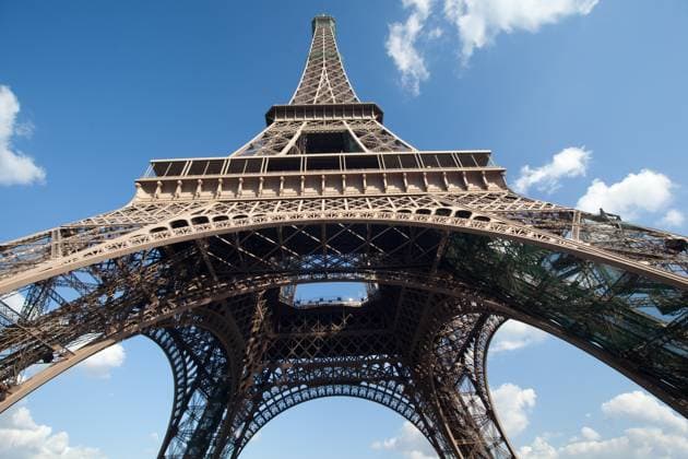 A view from below the Eiffel Tower showing the blue sky and clouds Copyright: xTonyxNorthrupx xDesignxPicsx , 30932077 Copyright: TonyxNorthrupx xDesignxPics 30932077